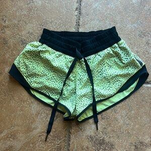 Lululemon running shorts Size 4, neon yellow with black spots, 2.5 inch inseam